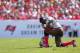 TAMPA, FL - OCTOBER 13: Gerald McCoy #93 of the Tampa Bay Buccaneers takes a knee during a game against the Philadelphia Eagles at Raymond James Stadium on October 13, 2013 in Tampa, Florida. (Photo by Mike Ehrmann/Getty Images)