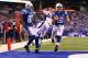 INDIANAPOLIS, IN - OCTOBER 20: Andrew Luck #12 of the Indianapolis Colts scores a touchdown against the Denver Broncos at Lucas Oil Stadium on October 20, 2013 in Indianapolis, Indiana. The Colts beat the Broncos 39-33. (Photo by Dilip Vishwanat/Getty I