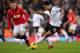 LONDON, ENGLAND - NOVEMBER 02: Wayne Rooney of Manchester United marshalls Kieran Richardson of Fulham during the Barclays Premier League match between Fulham and Manchester United at Craven Cottage on November 2, 2013 in London, England. (Photo by Cliv