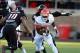 Nov 2, 2013; Lubbock, TX, USA; Oklahoma State Cowboys running back Desmond Roland (26) rushes against the Texas Tech Red Raiders in the first quarter at Jones AT&T Stadium. Mandatory Credit: Michael C. Johnson-USA TODAY Sports