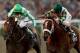 ARCADIA, CA - NOVEMBER 02: Mucho Macho Man (right), riden by Gary Stevens crosses the finish line ahead of Declaration of War, riden by Joseph O'Brien to win the Breeders' Cup Classic during the 2013 Breeders' Cup World Championships at Santa Anita Park