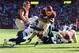 LANDOVER, MD - NOVEMBER 03: Alfred Morris #46 of the Washington Redskins rushes for a second quarter touchdown whilie being tackled by Eric Weddle #32 of the San Diego Chargers at FedExField on November 3, 2013 in Landover, Maryland. (Photo by Rob Carr