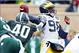 Nov 2, 2013; East Lansing, MI, USA; Michigan Wolverines quarterback Devin Gardner (98) has his throw hurried by Michigan State Spartans linebacker Max Bullough (40) during the 1st half of a game at Spartan Stadium. Mandatory Credit: Mike Carter-USA TODAY