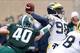 EAST LANSING, MI - NOVEMBER 02: Max Bullough #40 of the Michigan State Spartans closes in on Devin Gardner #98 of the Michigan Wolverines in the first quarter at Spartan Stadium on November 2, 2013 in East Lansing, Michigan. (Photo by Gregory Shamus/Getty