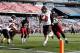 FOXBORO, MA - NOVEMBER 2: Jordan Lynch #6 of the Northern Illinois Huskies runs the ball for a touchdown by Robert Kitching #92 of the Massachusetts Minutemen in the 2nd half during a game with the Massachusetts Minutemen at Gillette Stadium on November