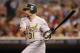 MINNEAPOLIS, MN - JULY 13: Jonny Gomes #31 of the Oakland Athletics hits an RBI single against the Minnesota Twins during the ninth inning on July 13, 2012 at Target Field in Minneapolis, Minnesota. The Athletics defeated the Twins 6-3. (Photo by Hannah