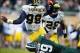 Nov 2, 2013; East Lansing, MI, USA; Michigan Wolverines quarterback Devin Gardner (98) is sacked by Michigan State Spartans defensive end Shilique Calhoun (89) during the 2nd half of a game at Spartan Stadium. MSU won 29-6. Mandatory Credit: Mike Carter-U