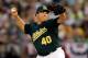 OAKLAND, CA - OCTOBER 04: Bartolo Colon #40 of the Oakland Athletics throws a pitch in the first inning against the Detroit Tigers during Game One of the American League Division Series at O.co Coliseum on October 4, 2013 in Oakland, California. (Photo