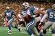23 OCT 1994: DETROIT LION LINEBACKER CHRIS SPIELMAN HEADS FOR THE ENDZONE AFTER STRIPPING THE BALL FROM THE HANDS OF CHICAGO BEAR CHRIS GEDNEY DURING THE FIRST HALF OF THE LION''S 21-16 VICTORY OVER THE BEARS. Mandatory Credit: Todd Rosenberg/ALLSPORT