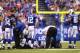 INDIANAPOLIS, IN - OCTOBER 20: Reggie Wayne #87 of the Indianapolis Colts is tended to by medical personal after injuring his knee against the Denver Broncos at Lucas Oil Stadium on October 20, 2013 in Indianapolis, Indiana. The Colts beat the Broncos 3