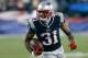FOXBORO, MA - SEPTEMBER 12: Aqib Talib #31 of the New England Patriots runs the ball after he intercepted a pass intended for a New York Jets receiver in the 4th quarter at Gillette Stadium on September 12, 2013 in Foxboro, Massachusetts. (Photo by Jim Ro