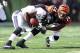 CINCINNATI, OH - DECEMBER 30: Jacoby Jones #12 of the Baltimore Ravens is tackled by Adam Jones #24 of the Cincinnati Bengals during the NFL game at Paul Brown Stadium on December 30, 2012 in Cincinnati, Ohio. (Photo by Andy Lyons/Getty Images)
