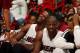 MIAMI, FL - NOVEMBER 3: Chris Bosh #1 and Dwyane Wade #3 of the Miami Heat smiles against the Washington Wizards on November 3, 2013 at American Airlines Arena in Miami, Florida. NOTE TO USER: User expressly acknowledges and agrees that, by downloading an