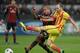 Nigel de Jong (Left) battles with Andres Iniesta.