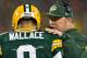 Nov 4, 2013; Green Bay, WI, USA; Green Bay Packers head coach Mike McCarthy talks with quarterback Seneca Wallace (9) during the first quarter against the Chicago Bears at Lambeau Field. Mandatory Credit: Jeff Hanisch-USA TODAY Sports