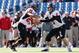 FOXBORO, MA - NOVEMBER 2: Jordan Lynch #6 of the Northern Illinois Huskies hands the ball to Joel Bouagnon #28 against the Massachusetts Minutemen in the 1st half at Gillette Stadium on November 2, 2013 in Foxboro, Massachusetts. (Photo by Jim Rogash/Get