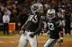 October 6, 2013; Oakland, CA, USA; Oakland Raiders defensive end Lamarr Houston (99) celebrates after sacking San Diego Chargers quarterback Philip Rivers (17 not pictured) as cornerback Tracy Porter (23) looks on during the second quarter at O.co Coliseu