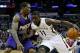 Nov 5, 2013; New Orleans, LA, USA; New Orleans Pelicans point guard Jrue Holiday (11) drives past Phoenix Suns point guard Eric Bledsoe (2) during the first quarter at New Orleans Arena. Mandatory Credit: Derick E. Hingle-USA TODAY Sports