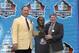 CANTON, OH - AUGUST 3: Pro Football Hall of Fame inductee Joe DeLamielleure (L) poses with his bust and his presenter, sportswriter Larry Felser during the 2003 NFL Hall of Fame Induction ceremony on August 3, 2003 in Canton, Ohio. (Photo by David Maxwe
