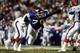 TAMPA, FL - JANUARY 27: Defensive tackle Leonard Marshall #70 of the New York Giants pressures quarterback Jim Kelly #12 of the Buffalo Bills during Super Bowl XXV at Tampa Stadium on January 27, 1991 in Tampa, Florida. The Giants defeated the Bills 20-1
