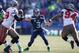 SEATTLE, WA - NOVEMBER 03: Quarterback Russell Wilson #3 of the Seattle Seahawks passes against the Tampa Bay Buccaneers at CenturyLink Field on November 3, 2013 in Seattle, Washington. (Photo by Otto Greule Jr/Getty Images)