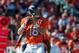 DENVER, CO - OCTOBER 27: Quarterback Peyton Manning #18 of the Denver Broncos scans down the field for an open receiver against the Washington Redskins at Sports Authority Field Field at Mile High on October 27, 2013 in Denver, Colorado. (Photo by Dusti