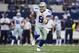 ARLINGTON, TX - NOVEMBER 3: Tony Romo #9 of the Dallas Cowboys runs the ball against the Minnesota Vikings at AT&T Stadium on November 3, 2013 in Arlington, Texas. The Cowboys defeated the Vikings 27-23. (Photo by Wesley Hitt/Getty Images)
