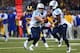 ST. LOUIS, MO - NOVEMBER 3: Jake Locker #10 of the Tennessee Titans hands the ball off to Chris Johnson #28 of the Tennessee Titans at the Edward Jones Dome on November 3, 2013 in St. Louis, Missouri. The Titans beat the Rams 28-21. (Photo by Dilip Vishw