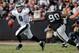 OAKLAND, CA - NOVEMBER 03: Quarterback Nick Foles #9 of the Philadelphia Eagles looks to throw as defensive tackle Pat Sims #90 of the the Oakland Raiders rushes him in the second quarter on November 3, 2013 at O.co Coliseum in Oakland, California. The