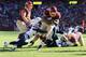 LANDOVER, MD - NOVEMBER 03: Alfred Morris #46 of the Washington Redskins rushes for a second quarter touchdown whilie being tackled by Eric Weddle #32 of the San Diego Chargers at FedExField on November 3, 2013 in Landover, Maryland. (Photo by Rob Carr