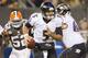 CLEVELAND, OH - NOVEMBER 3: Quarterback Joe Flacco #5 of the Baltimore Ravens scrambles under pressure from inside linebacker D'Qwell Jackson #52 of the Cleveland Browns during the second half at FirstEnergy Stadium on November 3, 2013 in Cleveland, Ohio.