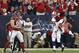 HOUSTON, TX - NOVEMBER 03: Antonio Smith #94 of the Houston Texans leaps in the air after sacking Andrew Luck #12 of the Indianapolis Colts as J.J. Watt #99 looks on at Reliant Stadium on November 3, 2013 in Houston, Texas. (Photo by Bob Levey/Getty Ima
