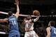 CLEVELAND, OH - NOVEMBER 4: Kyrie Irving #2 of the Cleveland Cavaliers goes up and passes to a teammate around Nikola Pekovic #14 of the Minnesota Timberwolves at The Quicken Loans Arena on November 4, 2013 in Cleveland, Ohio. NOTE TO USER: User expressl