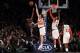 Oct 25, 2013; New York, NY, USA; Charlotte Bobcats point guard Kemba Walker (15) has his shot blocked by New York Knicks power forward Andrea Bargnani (77) in front of center Tyson Chandler (6) and shooting guard Iman Shumpert (21) during the third quarte