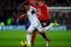 CARDIFF, WALES - NOVEMBER 03: Angel Rangel of Swansea City battles with Craig Bellamy of Cardiff City during the Barclays Premier League match between Cardiff City and Swansea City at Cardiff City Stadium on November 3, 2013 in Cardiff, Wales. (Photo by