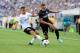 Aug 4, 2013; East Rutherford, NJ, USA;Valencia defender Joao Pereira (12) defends against Internazionale midfielder Zdravko Kuzmanovic (17) during the second half at Metlife Stadium. Valencia won the match 4-0. Mandatory Credit: Joe Camporeale-USA TODAY S