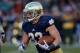 SOUTH BEND, IN - NOVEMBER 02: Cam McDaniel #33 of the Notre Dame Fighting Irish runs for a touchdown against the Navy Midshipmen at Notre Dame Stadium on November 2, 2013 in South Bend, Indiana. Notre Dame defeated Navy 38-34. (Photo by Jonathan Daniel/Ge