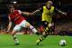 LONDON, ENGLAND - OCTOBER 22: Aaron Ramsey of Arsenal marshalls Marcel Schmelzer of Borussia Dortmund during the UEFA Champions League Group F match between Arsenal and Borussia Dortmund at Emirates Stadium on October 22, 2013 in London, England. (Phot