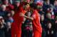 LIVERPOOL, ENGLAND - MARCH 10: Luis Suarez of Liverpool celebrates his goal to make it 1-0 with Philippe Coutinho during the Barclays Premier League match between Liverpool and Tottenham Hotspurs at Anfield on March 10, 2013 in Liverpool, England. (Photo