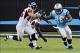 Nov 3, 2013; Charlotte, NC, USA; Carolina Panthers running back Jonathan Stewart (28) breaks a tackle of Atlanta Falcons linebacker Paul Worrilow (55) and linebacker Akeem Dent (52) during the game at Bank of America Stadium. Panthers win 34-10. Mandatory