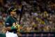 OAKLAND, CA - OCTOBER 04: Yoenis Cespedes #52 of the Oakland Athletics looks on against the Detroit Tigers during Game One of the American League Division Series at O.co Coliseum on October 4, 2013 in Oakland, California. (Photo by Thearon W. Henderson/