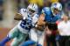 DETROIT, MI - OCTOBER 27: Kris Durham #18 of the Detroit Lions catches a fourth quarter pass in front of Jakr Hamilton #23 of the Dallas Cowboys at Ford Field on October 27, 2013 in Detroit, Michigan. Detroit won the game 31-30. (Photo by Gregory Shamus/G