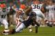 CHICAGO, IL - AUGUST 29: Khaseem Greene #60 of the Chicago Bears tackles Jamaine Cook #36 of the Cleveland Browns at Soldier Field on August 29, 2013 in Chicago, Illinois. The Browns defeated the Bears 18-16. (Photo by Jonathan Daniel/Getty Images)