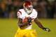 SOUTH BEND, IN - OCTOBER 19: Silas Redd #25 of the University of Southern California Trojans runs against the Notre Dame Fighting Irish at Notre Dame Stadium on October 19, 2013 in South Bend, Indiana. Notre Dame defeated USC 14-10. (Photo by Jonathan D