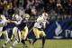 Nov 9, 2013; Pittsburgh, PA, USA; Notre Dame Fighting Irish quarterback Tommy Rees (right) passes under pressure from Pittsburgh Panthers defensive lineman Tyrone Ezell (50) during the fourth quarter at Heinz Field. Pittsburgh won 28-21. Mandatory Credit: