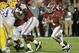 Nov 9, 2013; Tuscaloosa, AL, USA; Alabama Crimson Tide running back T.J. Yeldon (4) carries the ball pursued by LSU Tigers defensive tackle Ego Ferguson (9) during the fourth quarter at Bryant-Denny Stadium. Mandatory Credit: John David Mercer-USA TODAY S