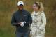 GULLANE, SCOTLAND - JULY 15: Tiger Woods of the United States smiles alongside skier Lindsey Vonn ahead of the 142nd Open Championship at Muirfield on July 15, 2013 in Gullane, Scotland. (Photo by Andy Lyons/Getty Images)