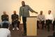 Junior Bridgeman (speaking) takes a break from his lucrative franchising business to serve as a mentor, from kids to NBA players, sharing advice based on his success on and especially off the court.