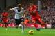 LIVERPOOL, ENGLAND - NOVEMBER 09: Luis Suarez of Liverpool competes with Elsad Zverotic of Fulham during the Barclays Premier League match between Liverpool and Fulham at Anfield on November 9, 2013 in Liverpool, England. (Photo by Alex Livesey/Getty I