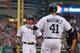 DETROIT, MI - AUGUST 31: Omar Infante #4 of the Detroit Tigers hits a three run home run in the second inning and is congratulated by teammate Victor Martinez #41 during the game against the Cleveland Indians at Comerica Park on August 31, 2013 in Detroit